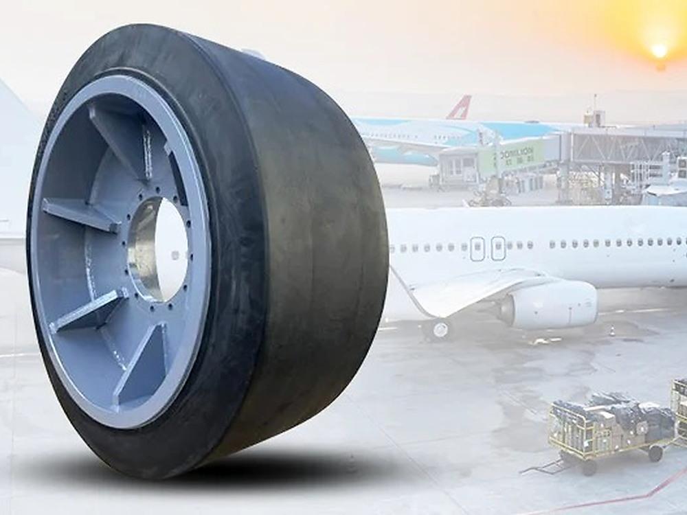 JABIL solid tyre for airport ground support equipment with aircraft and tarmac in background