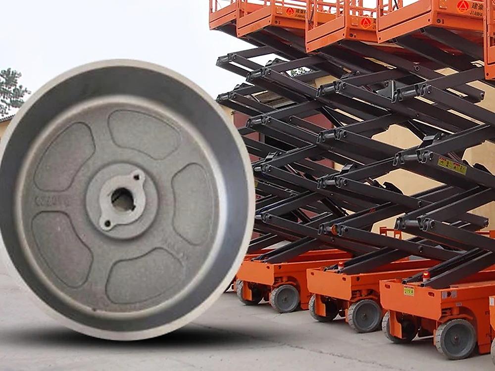 Grey non-marking scissor lift solid tyre with extended AWP platforms in background